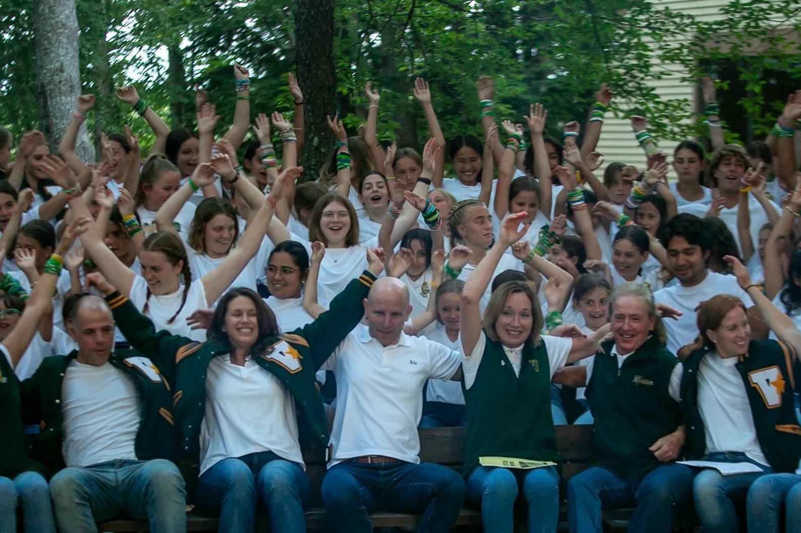 Campers and adults celebrating together in Vega green and white